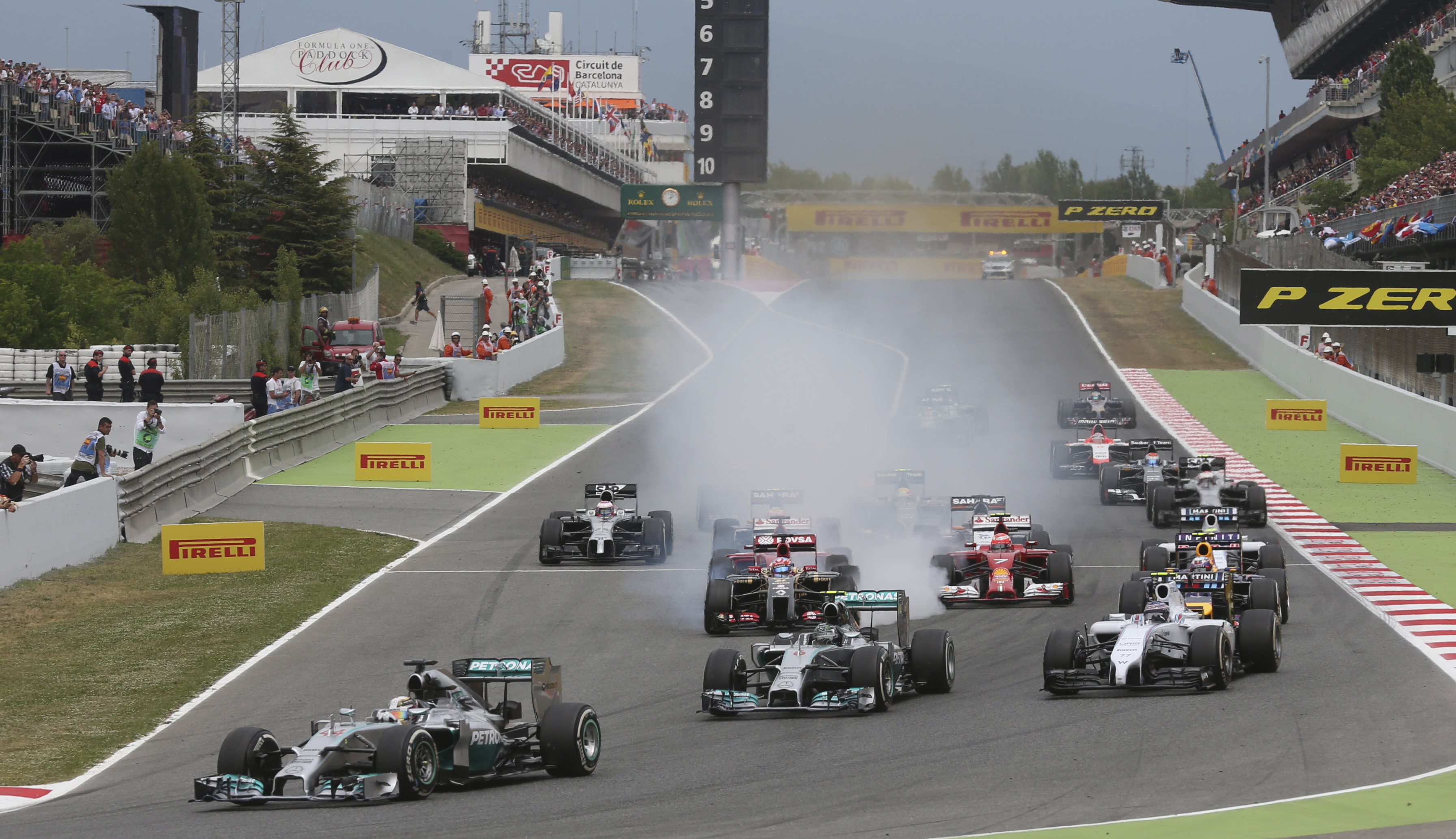 Mercedes driver Lewis Hamilton of Britain  leads the field after the start during the Spain Formula One Grand Prix at the Barcelona Catalunya racetrack in Montmelo, near Barcelona, Spain, Sunday, May 11, 2014.(AP Photo/Luca Bruno)